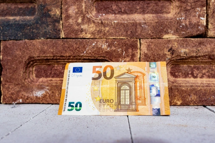 a 50 euro bill laying on the ground