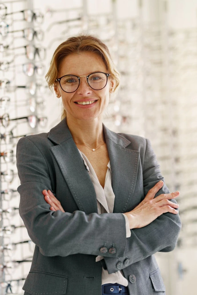 Portrait of middle-aged woman wearing glasses in optical store