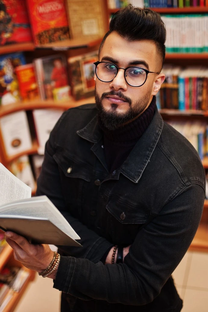 Arab student man at library