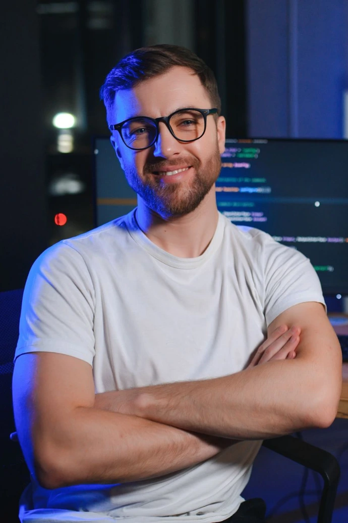 Smiling Man Working in a Modern Office