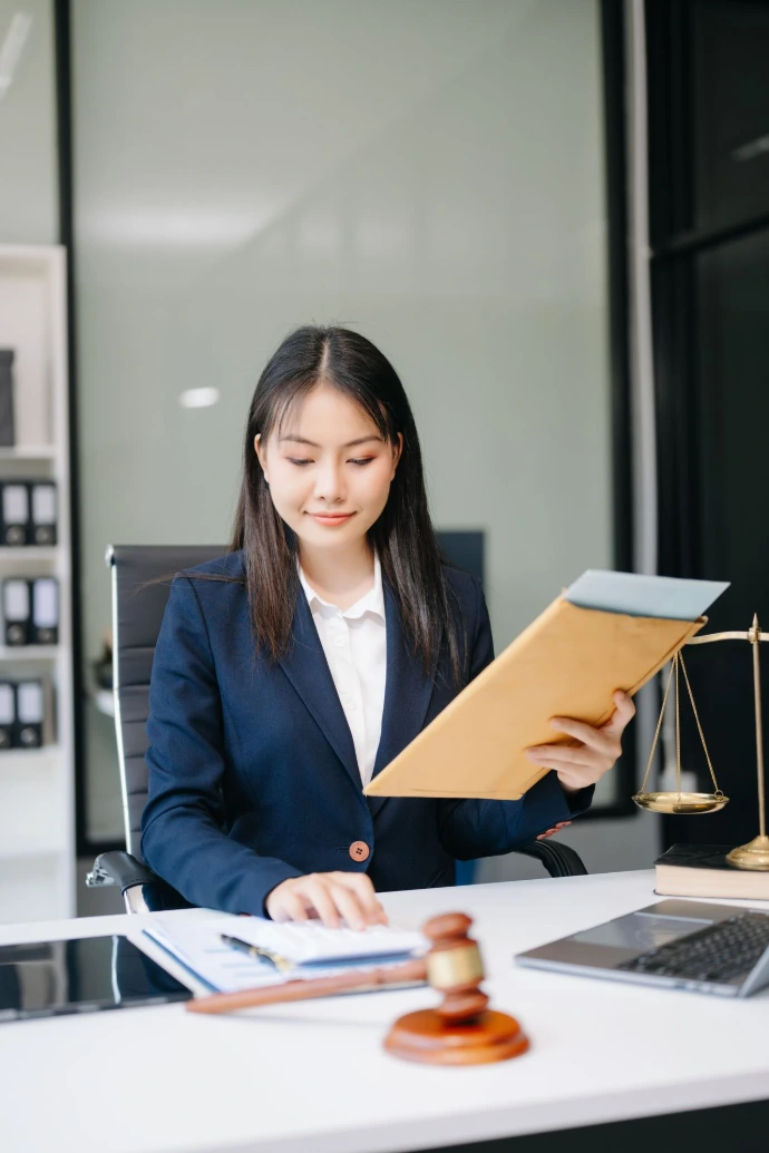 Young Business Woman Working at Her Office Desk